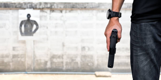 istock 9mm pistol gun and bullets 1763996434