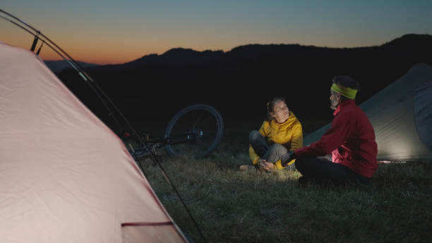 istock Camping in nature at sunset with tent. Autumn. 1764014985