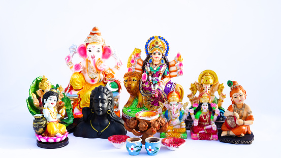 Indian God idol or statue isolated on white. Maa laxmi with Lord Ganesha, Adiyogi, Godess Durga on lion and Lord krishana Statue.
