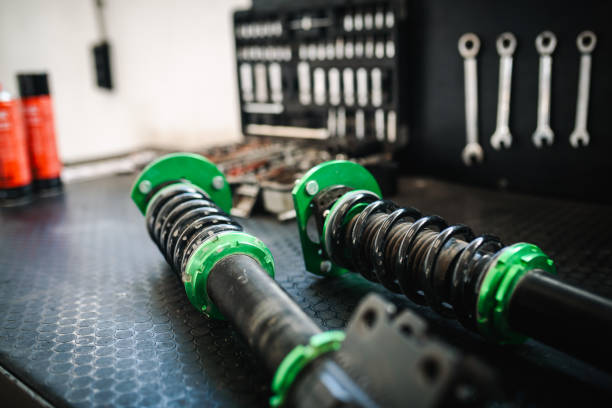 Shock absorber close up photo.  Auto repair shop close up photo.