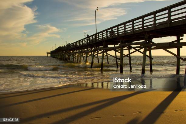 Beach Pier Over The Ocean Late Afternoon Stock Photo - Download Image Now - Beach, Day, Fishing