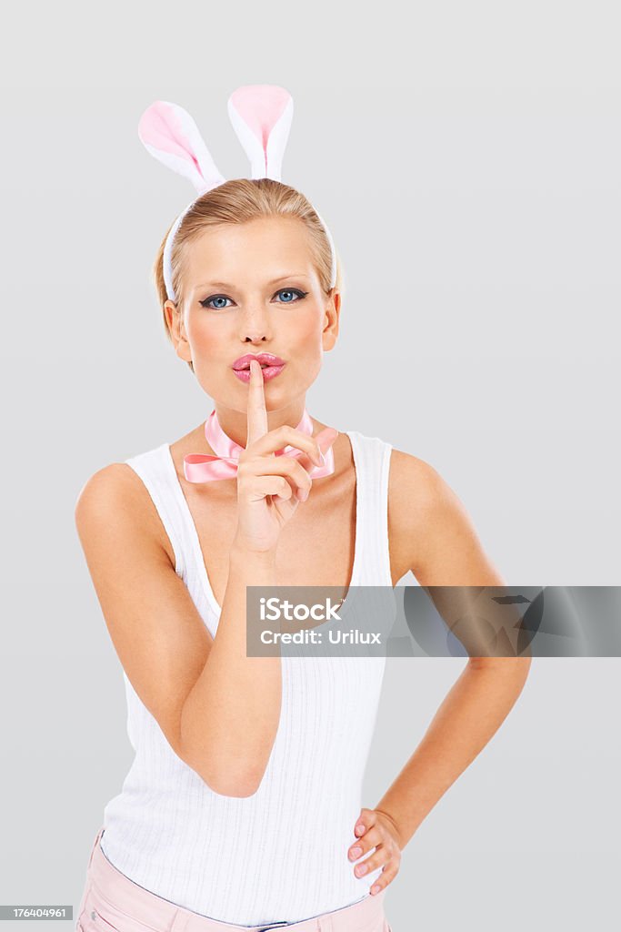 Shhhh - Keeping the Easter bunny a secret  Adult Stock Photo