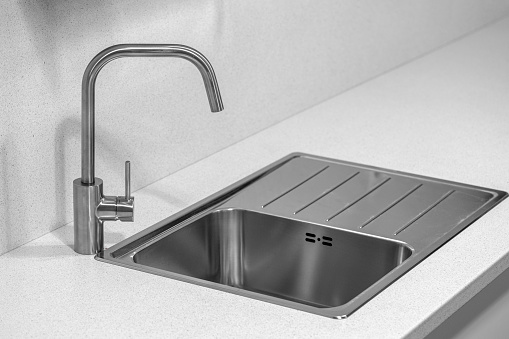 Kitchen sink with stainless steel faucet, sink