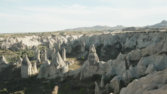 A panoramic view from a high mountain overlooking Love Valley and the rock formations in the shape of Fairy Chimneys.