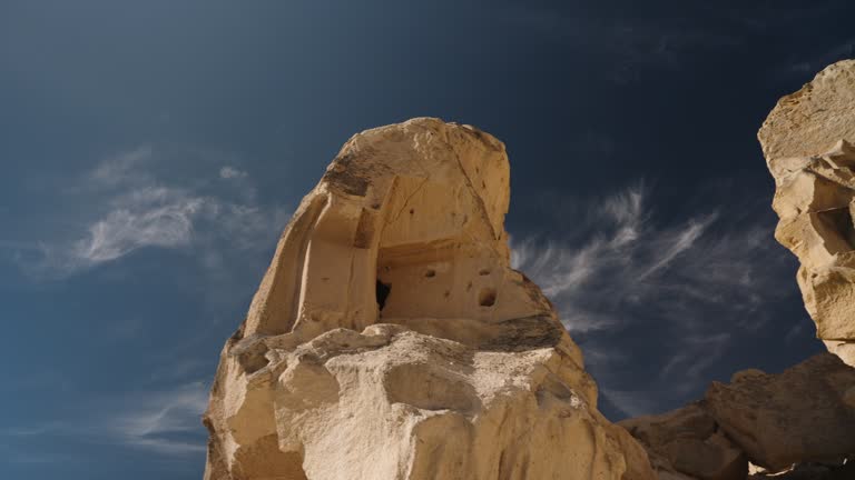 Panorama of the ancient city and houses carved into the cliffs and massive rocks by ancient people.