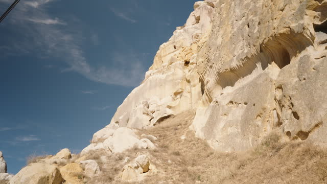 Dwellings of ancient people carved into the cliffs.