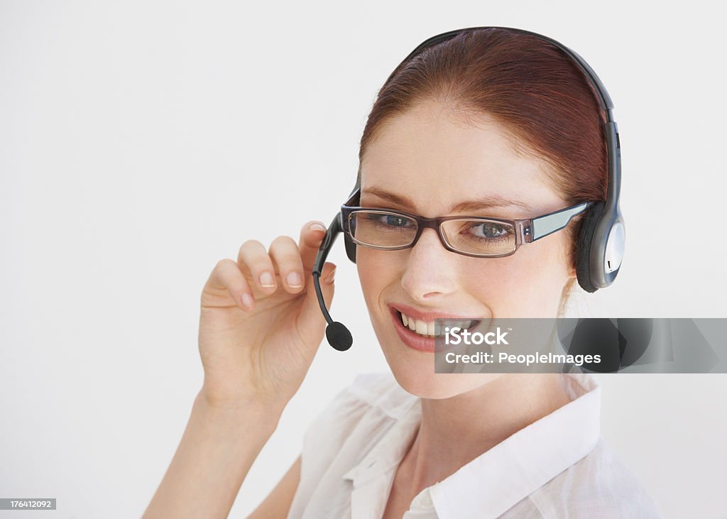Service with a smile A young telemarketer talking on her headset 20-24 Years Stock Photo