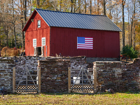 Photo of this red barn with the American flag taken in Erwinna in Tinicum Township, Bucks County, Pennsylvania, USA