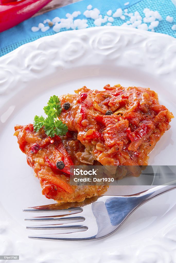 fish in Greek kind with vegetables and tomato sauce fish in Greek kind with vegetables and tomato saucefish in Greek kind with vegetables and tomato sauce Appetizer Stock Photo