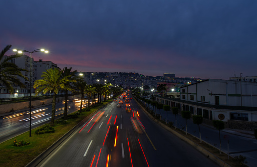 Highway in Algiers, Alger, Algeria by night. Long exposure with rays of light coming from the vehicles.