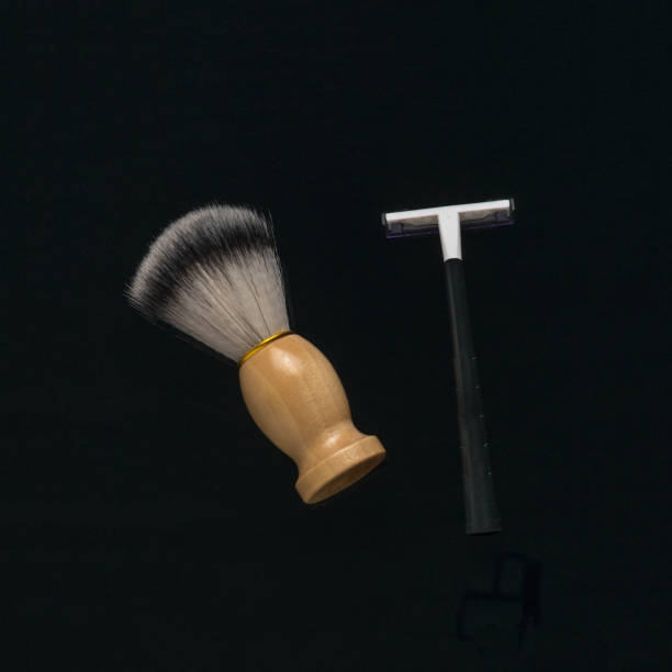istock A shaving brush and a man's razor on a black background. 1764230295