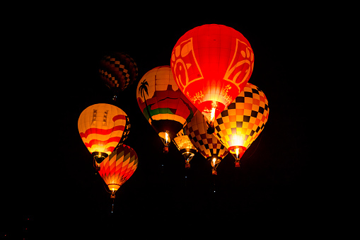 Albuquerque, New Mexico - USA - Oct 9, 2023: Dawn Patrol hot air balloons fly at the Albuquerque International Balloon Fiesta.