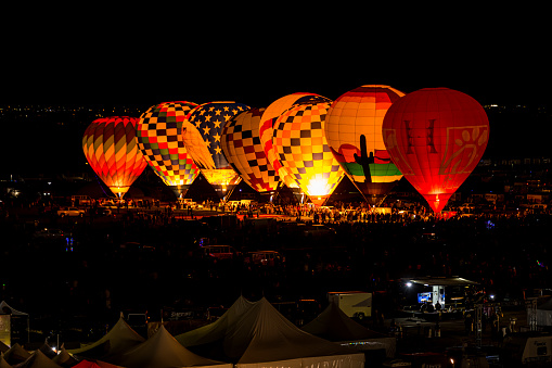 Albuquerque, New Mexico - USA - Oct 10, 2023: Dawn Patrol hot air balloons prepare to launch at the Albuquerque International Balloon Fiesta.