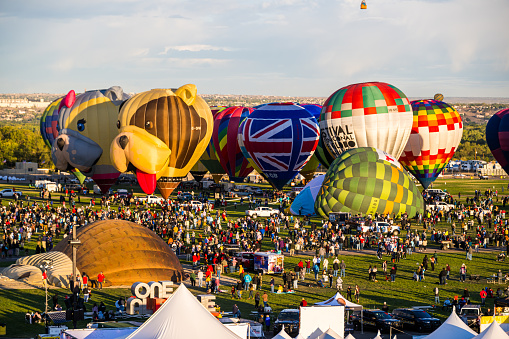 A hot air balloon is being inflated for an evening flight.