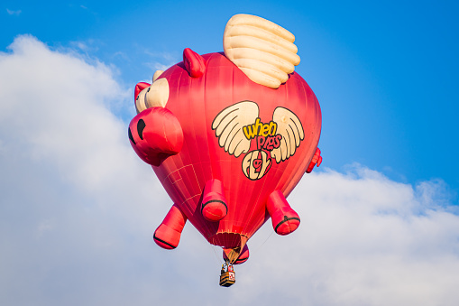 Albuquerque, New Mexico - USA - Oct 10, 2023: Hot Air Balloon “Ham-Let” flies at the Albuquerque International Balloon Fiesta