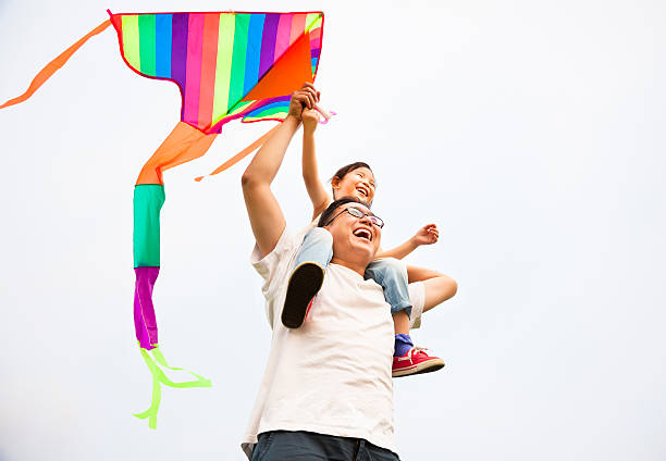 istock happy family with colorful kite 176423855