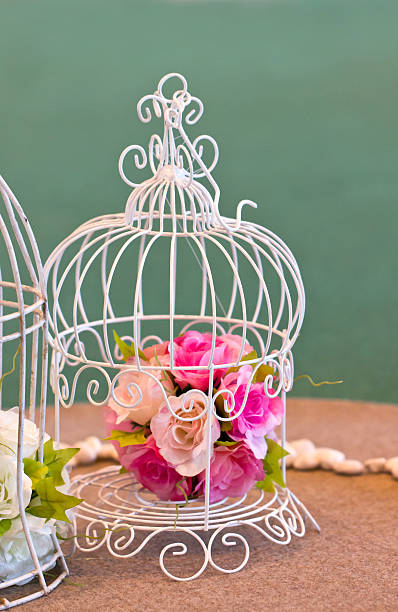 istock Artificial flowers bunch in white birdcage. 176423906