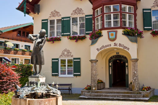statue of young Mozart and townhall on Mozartplatz in St. Gilgen, Austria