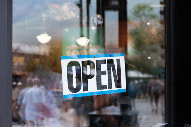 istock Open Sign Hanging in Shop Window 1764259642