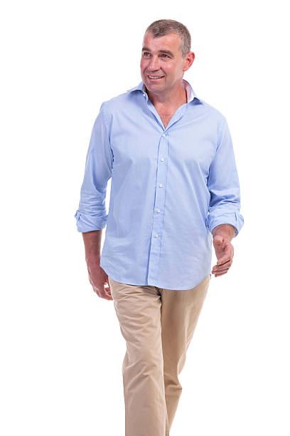 istock casual middle aged man walking 176426602
