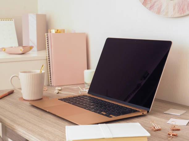 istock Interior image of a feminine workspace based on pastel pink and wood grain 1764283108