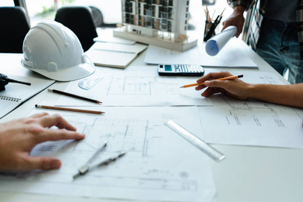 istock Group of engineer is discussion and brainstorming about blueprint of construction project in office 1764294852