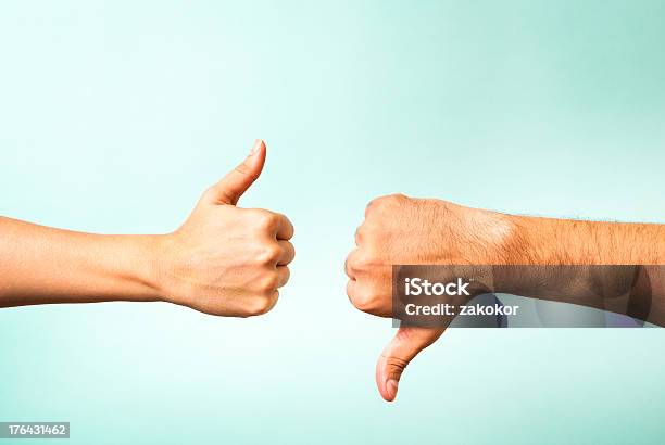 Two Hands Signalling Thumbs Up And Thumbs Down Stock Photo - Download Image Now - Yes - Single Word, Negative Emotion, Positive Emotion