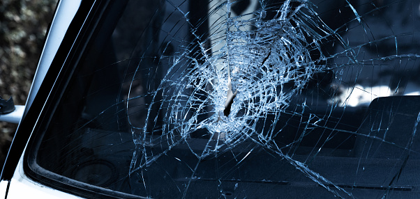 Broken car windshield glass on a car