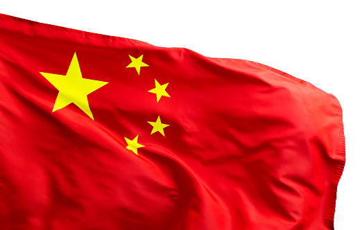 Chinese flag on pole waving in the wind against white background