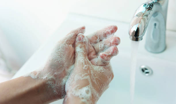 istock Washing hands under the flowing water tap 1764320619