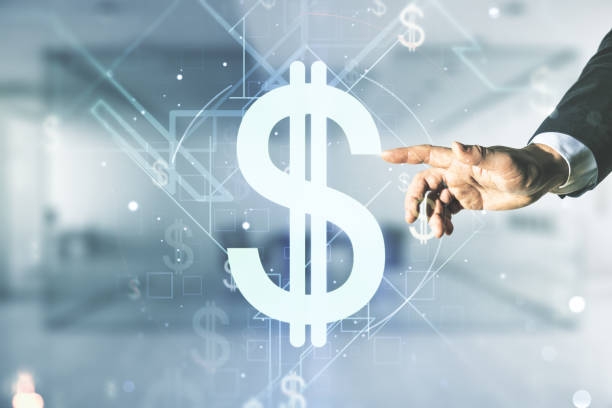 istock Man hand clicks on virtual USD symbols illustration on blurred office background. Trading and currency concept. Multiexposure 1764321704