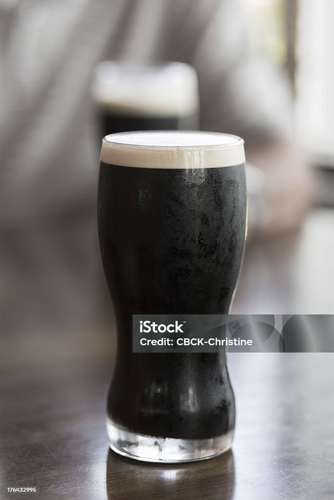 Stout A refreshing glass of stout on a table Adult Stock Photo