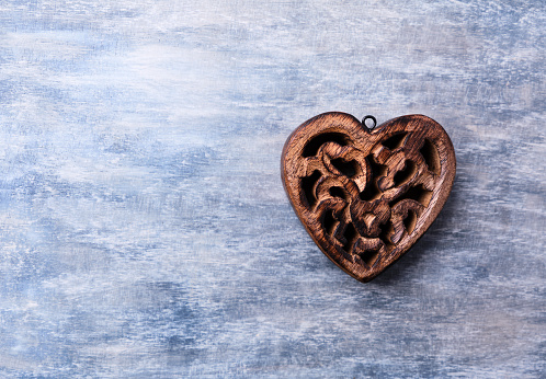 Wooden Heart on wooden background. Soft focus. Copy space.