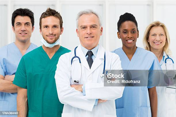 Happy Team Of Doctors Stock Photo - Download Image Now - Group Of People, Male Nurse, Doctor