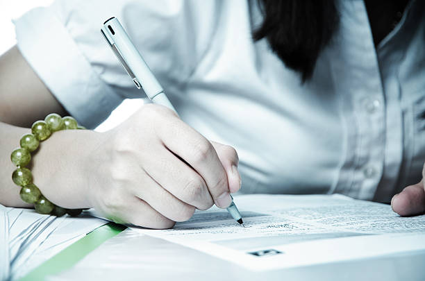 istock business woman sign a document 176437142