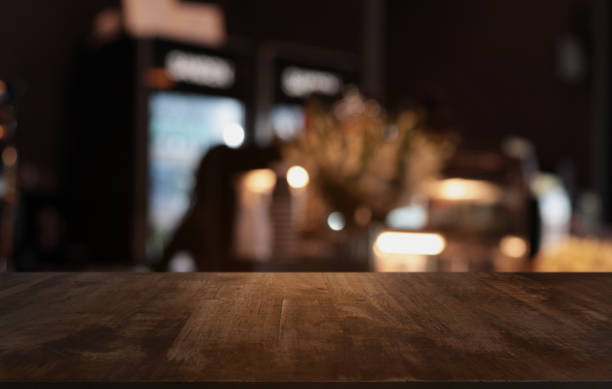 istock Wood Table Top in Blur Background room interior with empty copy space. 1764429028