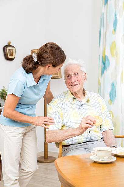 istock Caregiver with senior man 176445203