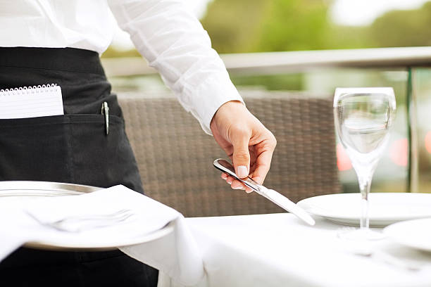 istock Close-Up Of Waiter Setting Table In Restaurant 176446678
