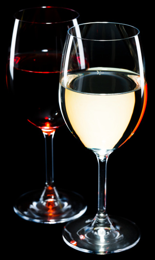 Glass of red and white wine on black background
