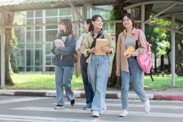 istock Group of Young Asian student walking and talking at university before class room. education, back to school concept 1764486041