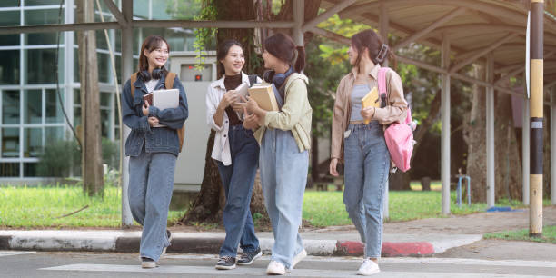 istock Group of Young Asian student walking and talking at university before class room. education, back to school concept 1764486054