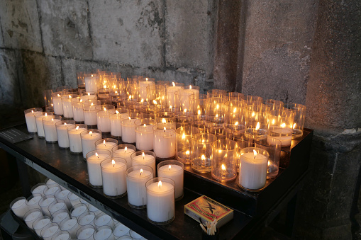 Prayer candles in the hallway of the Basilica of Saint Servatius in Maastricht, Limburg, Netherlands.