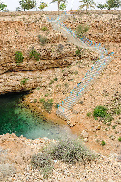 лестница в нижней части карст - natural phenomenon hawiyat najm park cliff cave стоковые фото и �изображения