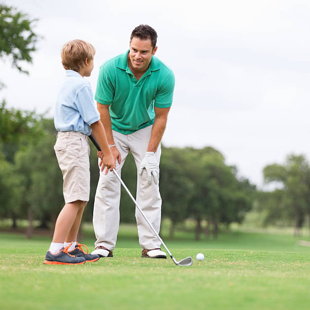 istock Father teaching his young son to golf 176450777