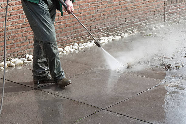 istock Worker cleaning the floor with high pressure water machine 176451052