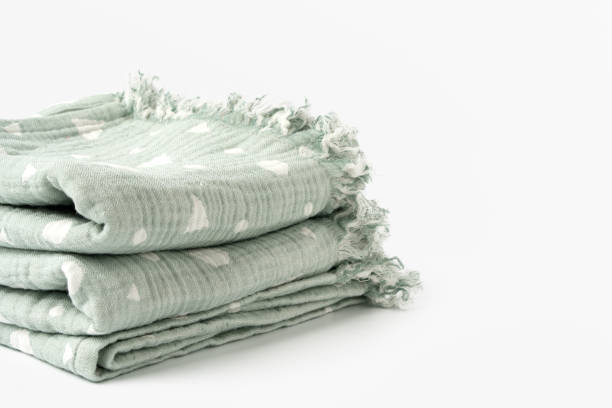 istock Green muslin blanket for kids on white background 1764511879