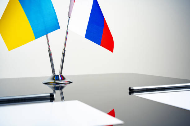 istock Russia and Ukraine flags on negotiation table 1764532524