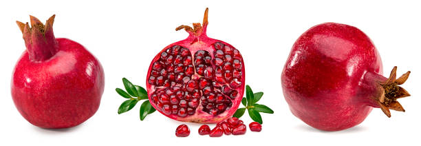 istock pomegranate with seeds and green leaves  isolated on white background. clipping path 1764546465