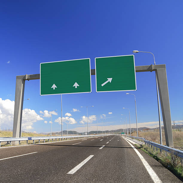 istock Blank green signs with arrows on empty highway 176455505