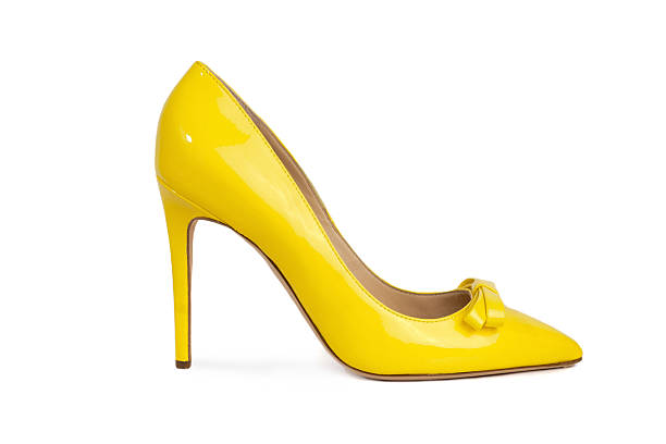 Female footwear Female footwear on white background yellow shoes stock pictures, royalty-free photos & images